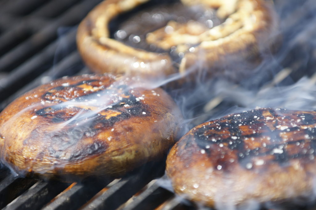 3 portobello mushrooms on the grill