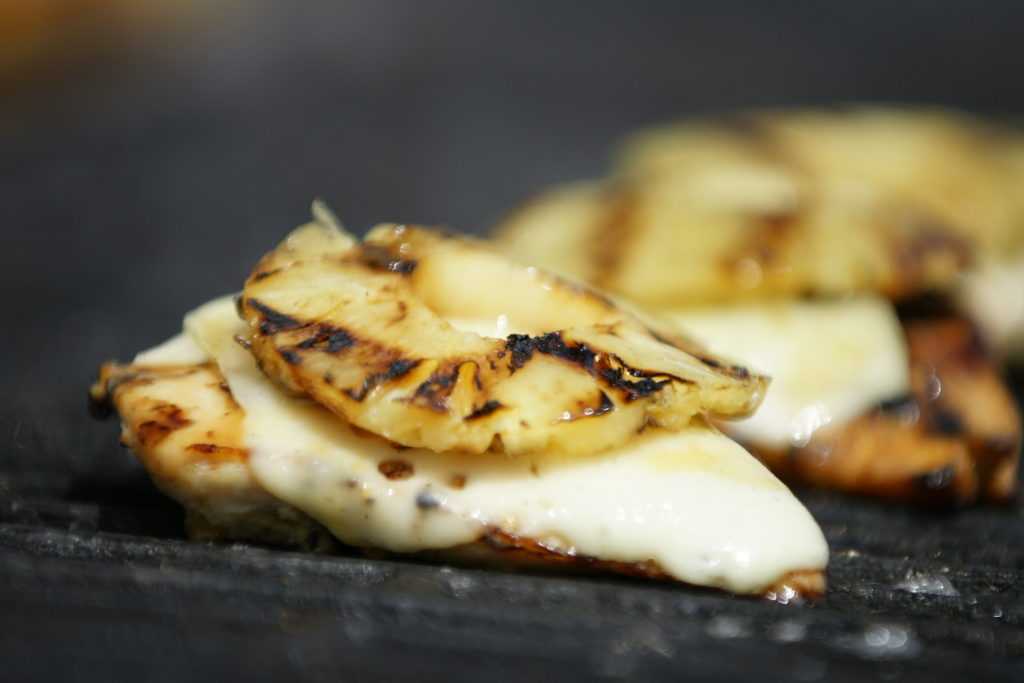 Teriyaki chicken grilled with cheese and a slice of grilled pineapple on top