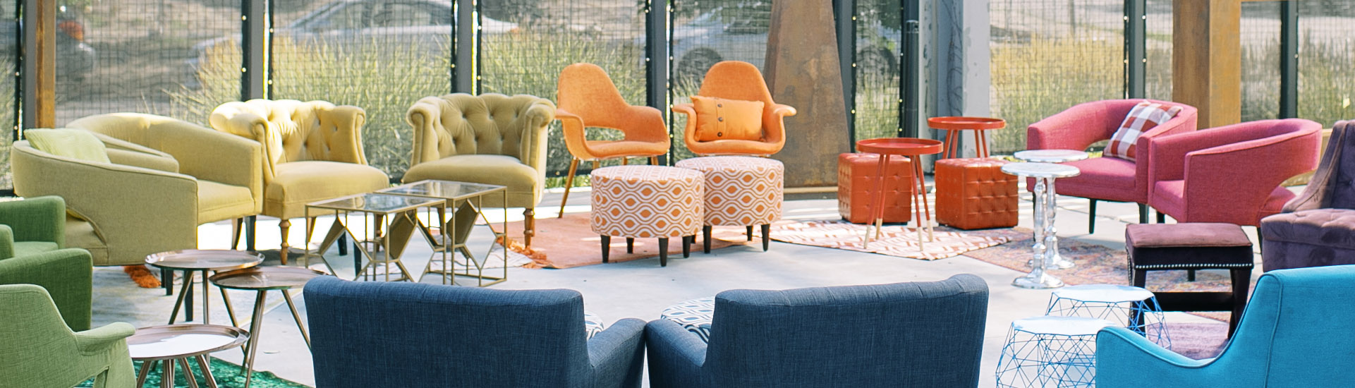 Colorful Chairs with color corresponding tables and rugs underneath