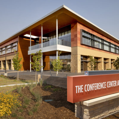 Outside of Conference Center at Ridgegate showcasing the sign and the whole building