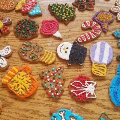 Decorated molasses christmas cookies in different shapes and different designs for the holidays