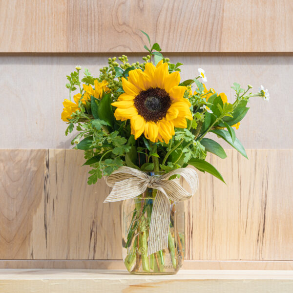 Sunflowers in a clear mason jar